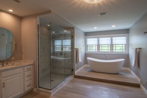 i. Mars bathroom combining warm and cool colors with grey- white marble and limestone chenille floor