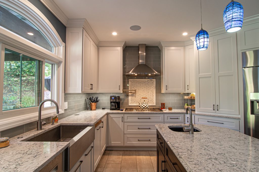 Traditional Style Ross Township Kitchen Using Shaker Doors with White Painted Finish on Island.