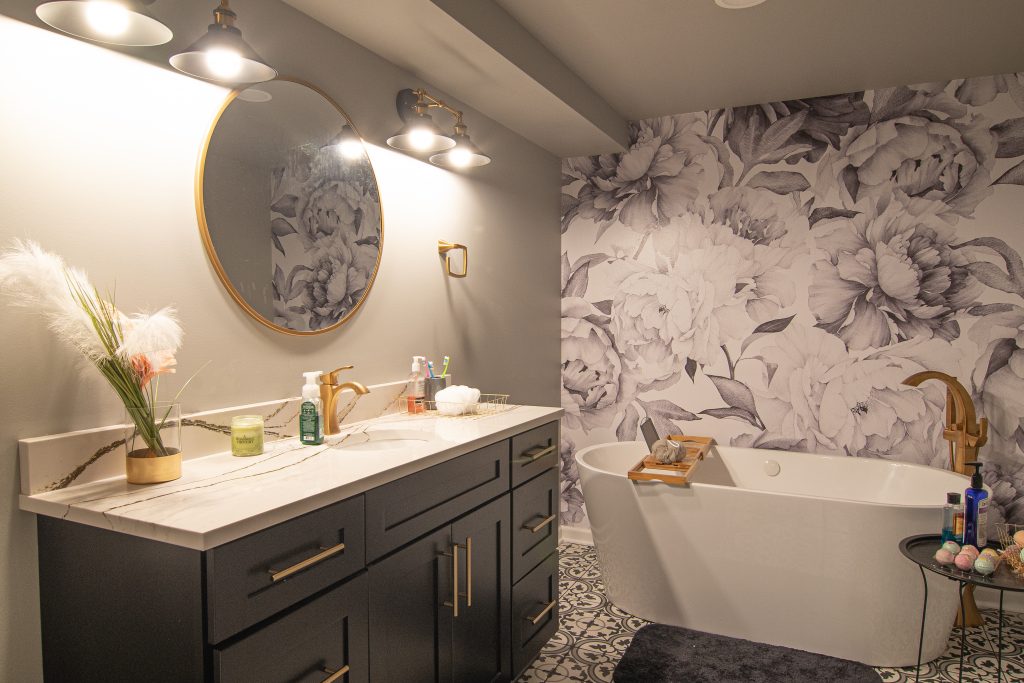 Modern Style Murrysville Master Bathroom Focusing On Stand-Alone Soaking Tub Accented By Gold Fixtures And Art Deco Floor.