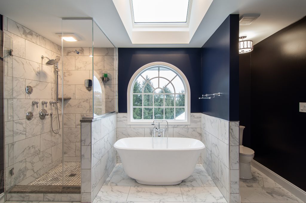 Picture of a Wexford, PA, bathroom featuring a freestanding bathtub and a pop of royal blue paint.