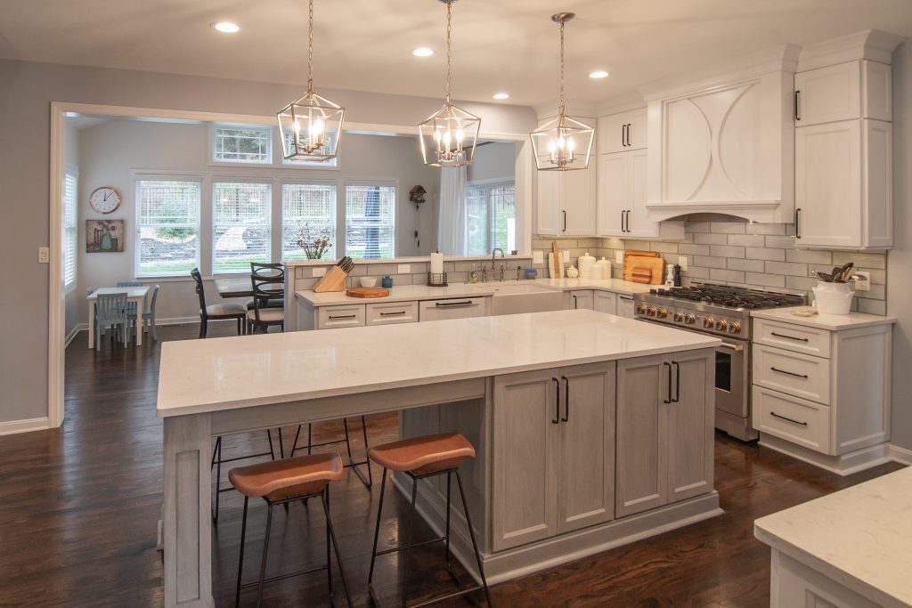 A traditional style Sewickley kitchen with the use of warmer tones accented by using two different colors in the cabinets.
