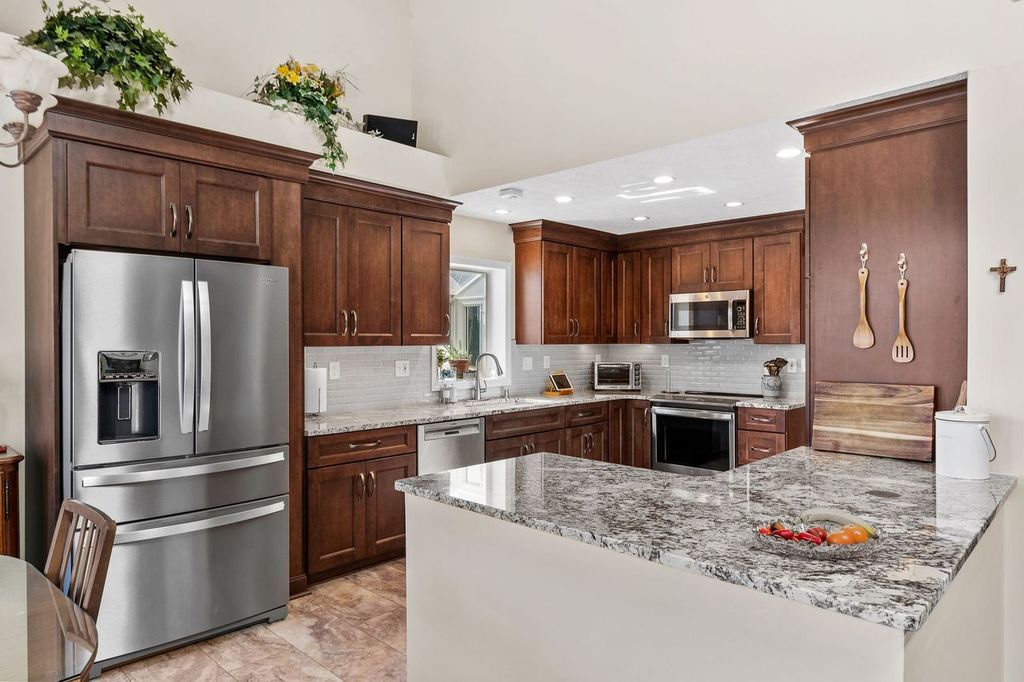 Picture of a warm Mt. Lebanon, PA, kitchen featuring wood tones creating a cozy yet elegant atmosphere that blends perfectly.