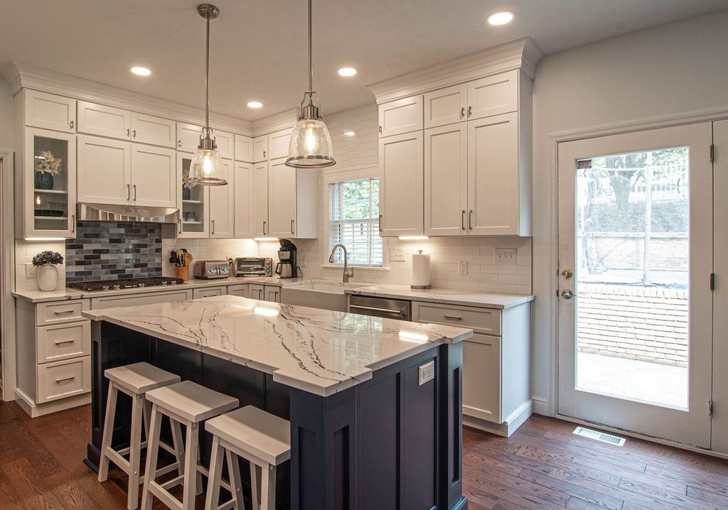 Picture of a traditional-style Pittsburgh, PA, two-tone kitchen using a shaker door style that maximizes space by double-stacking cabinets.