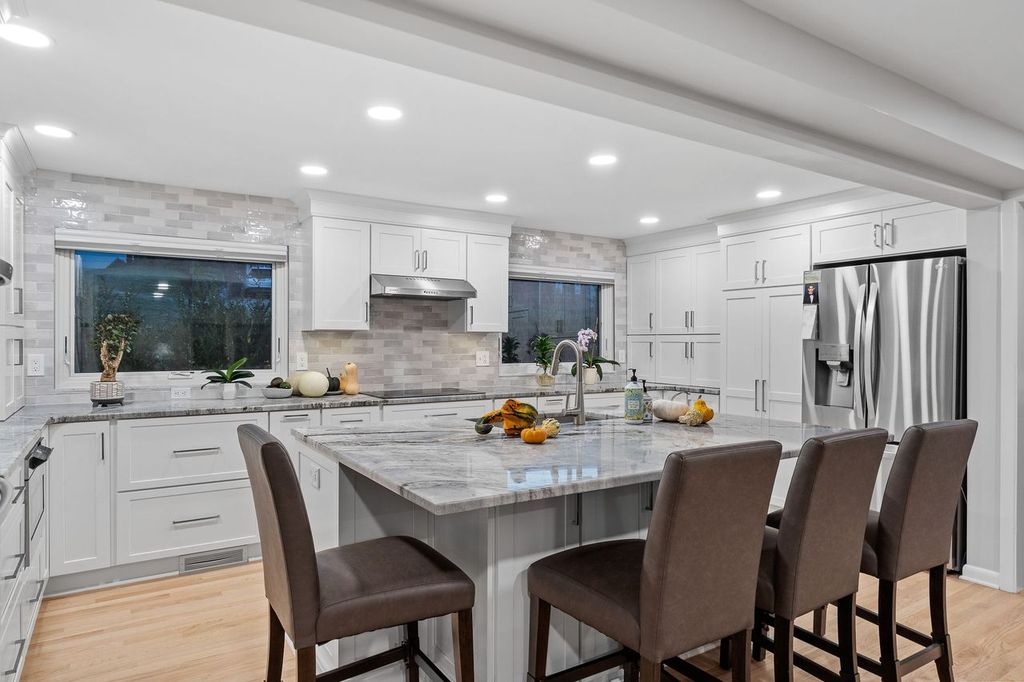 The overall design of this McCandless kitchen creates a spacious and inviting atmosphere, perfect for cooking and socializing.