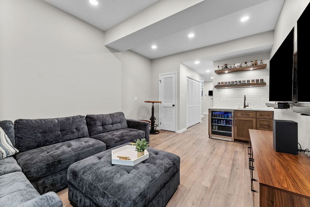 Stylish Venetia Basement Featuring a Cozy Multifunctional Entertainment Area Perfect for Family Time and Hosting Parties.