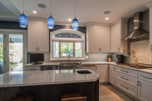 Traditional Style Ross Township Kitchen Using Shaker Doors with White Painted Finish on Island.