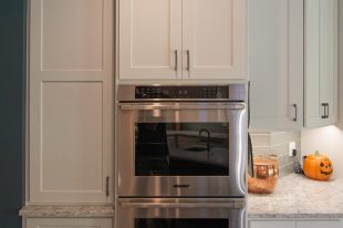 Traditional Style Ross Township Kitchen Using Shaker Doors with White Painted Finish on Island.