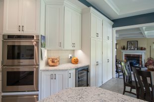 Traditional Style Ross Township Kitchen Using Shaker Doors with White Painted Finish on Island.