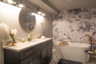 Modern Style Bridgeville Master Bathroom Focusing on Stand-Alone Soaking Tub Accented by Gold Fixtures and Art Deco Floor.
