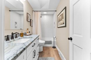 This Squirrel Hill Room’s Neutral Color Palette and Luxurious Fixtures Create a Serene Ambiance, Perfect for Relaxation.